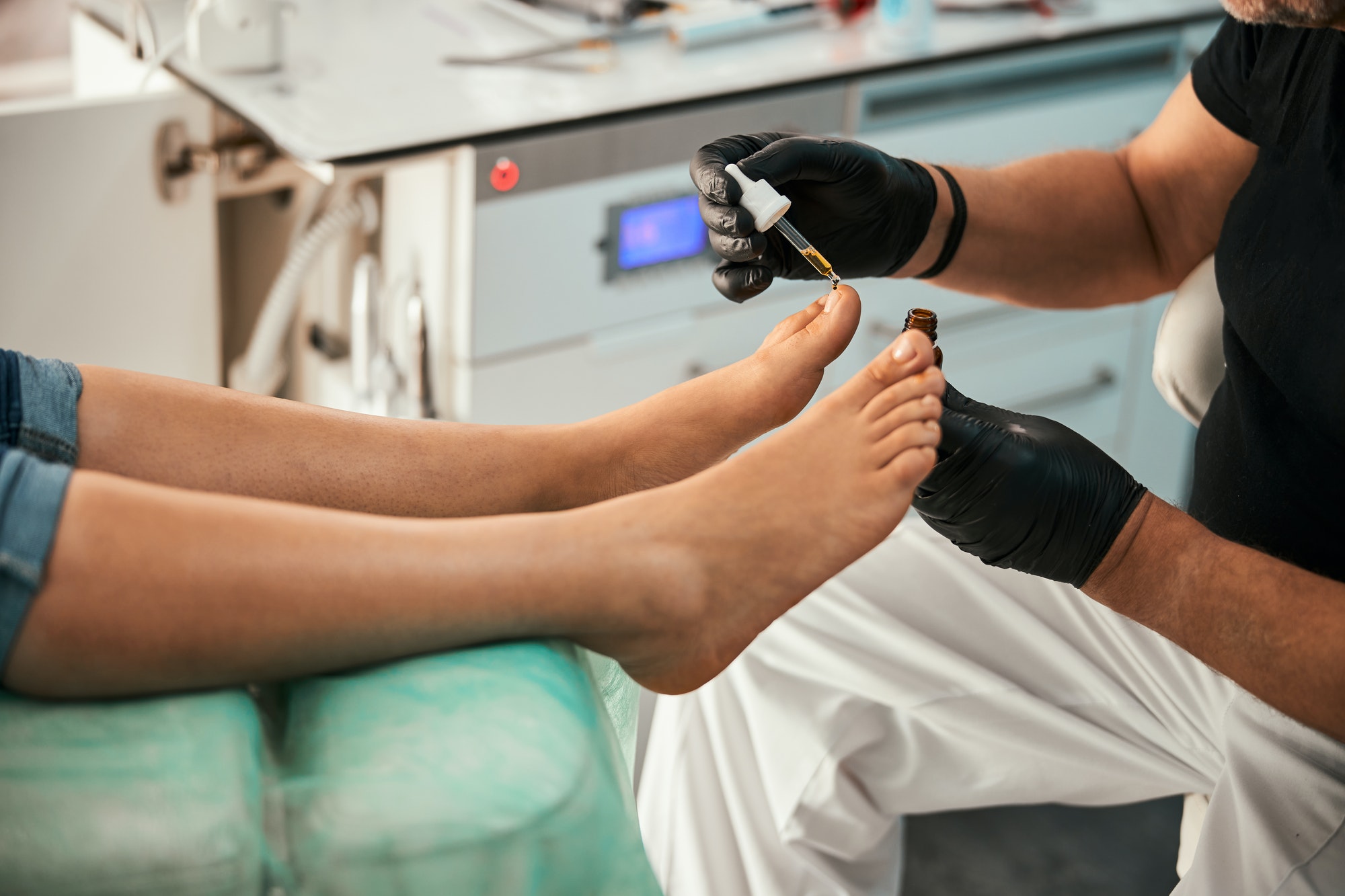 Relaxed female being on procedures in podiatry clinic